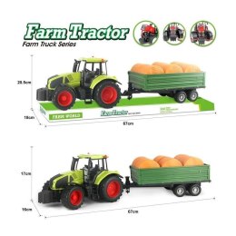 Traktor z belami słomy